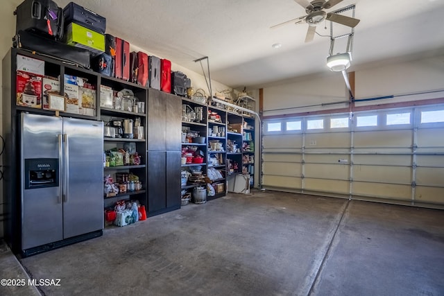 garage with a ceiling fan and stainless steel fridge with ice dispenser