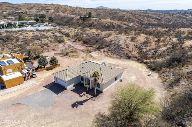 birds eye view of property featuring a mountain view