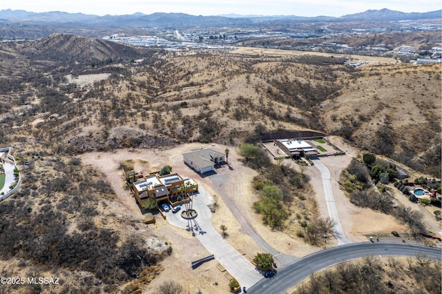 birds eye view of property featuring a mountain view