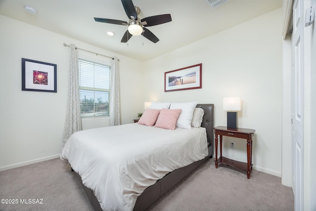 bedroom with light carpet, visible vents, baseboards, and ceiling fan