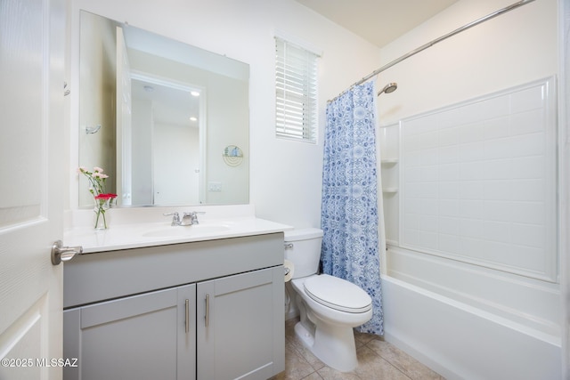 bathroom featuring toilet, shower / tub combo, vanity, and tile patterned floors