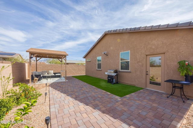 view of patio / terrace featuring an outdoor hangout area, area for grilling, and a fenced backyard