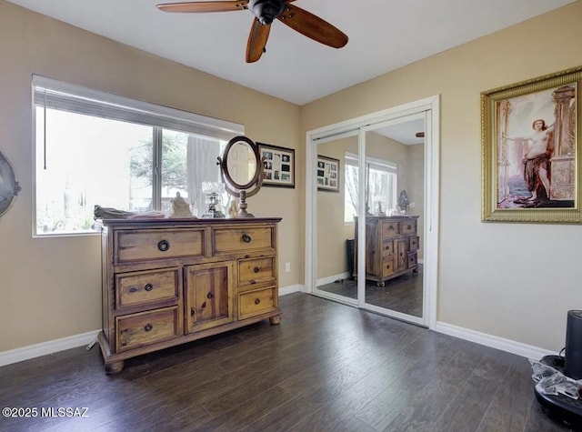 sitting room with dark wood-style floors, ceiling fan, and baseboards