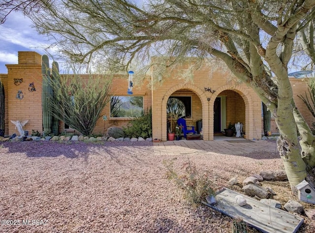 view of front of home featuring a patio area