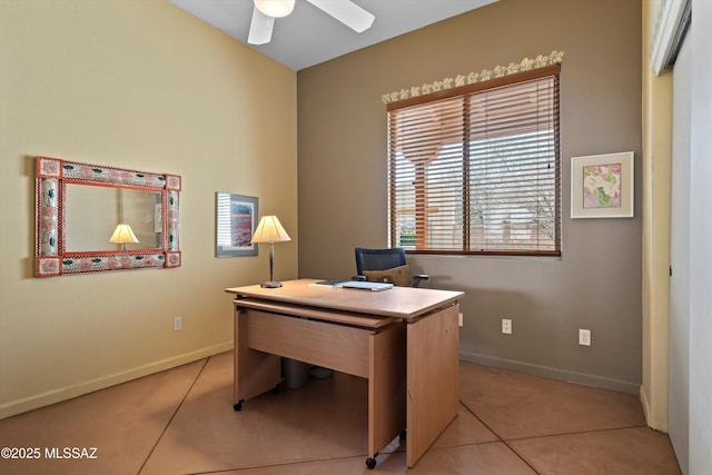 home office featuring a ceiling fan, light tile patterned flooring, and baseboards