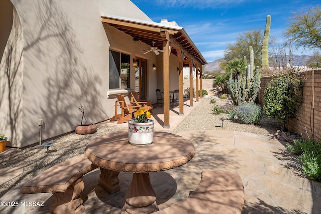 view of patio / terrace with a fenced backyard and a ceiling fan