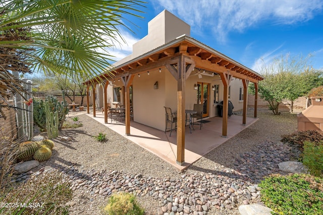 view of patio featuring a fenced backyard and a grill