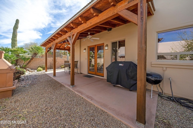 view of patio featuring a fenced backyard, ceiling fan, and area for grilling