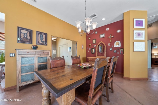 dining space featuring finished concrete flooring, baseboards, visible vents, and a notable chandelier