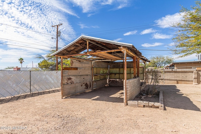 exterior space featuring an exterior structure and an outbuilding