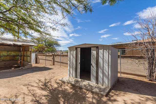 view of shed with a fenced backyard