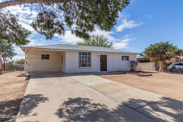 ranch-style home with fence