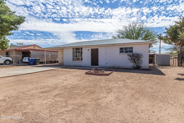 single story home with fence and brick siding