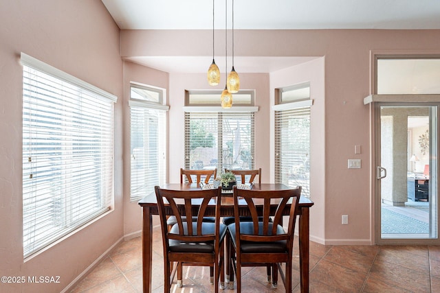 dining area featuring baseboards