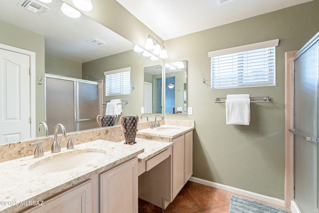 full bathroom with a sink, visible vents, and tile patterned floors