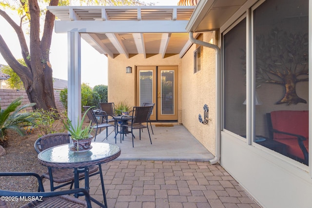 view of patio / terrace with outdoor dining area and a pergola