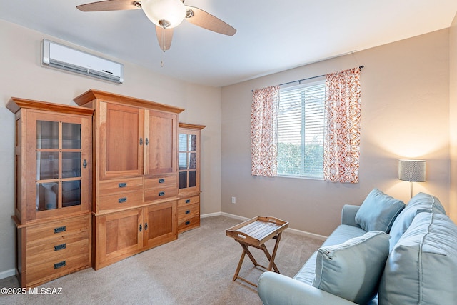 living area featuring a wall mounted air conditioner, ceiling fan, light carpet, and baseboards