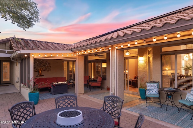 view of patio / terrace with an outdoor fire pit and outdoor dining space