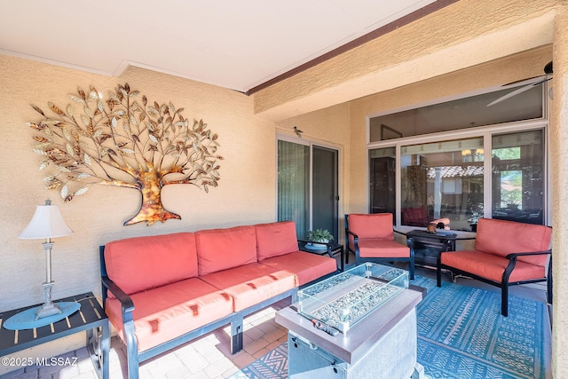 view of patio / terrace featuring an outdoor living space with a fire pit