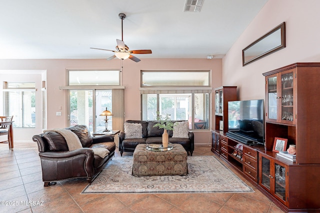 living area featuring visible vents, ceiling fan, and tile patterned floors