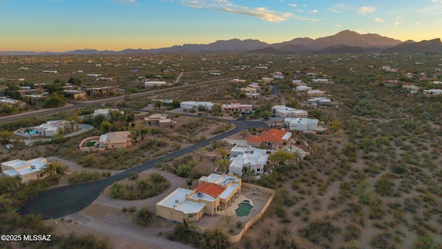 aerial view at dusk with a residential view and a mountain view