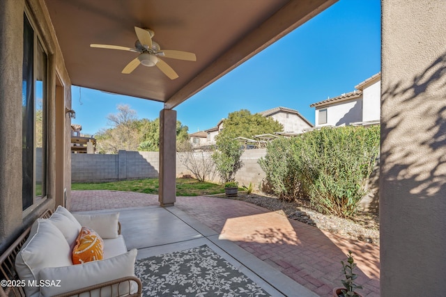 view of patio featuring a fenced backyard and ceiling fan