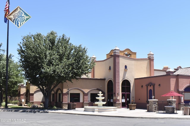 view of front of home featuring stucco siding