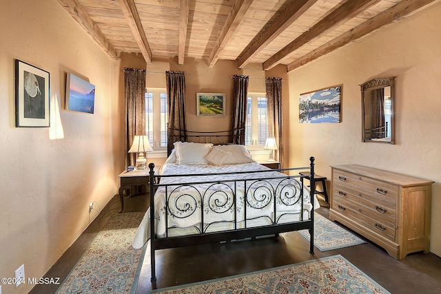 bedroom featuring wood ceiling, a textured wall, and beamed ceiling