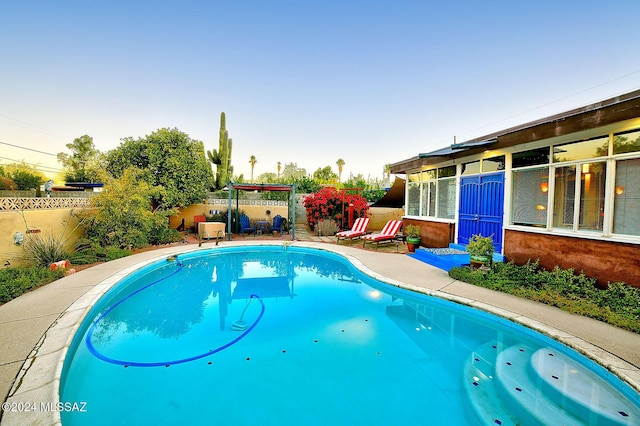 pool with a fenced backyard