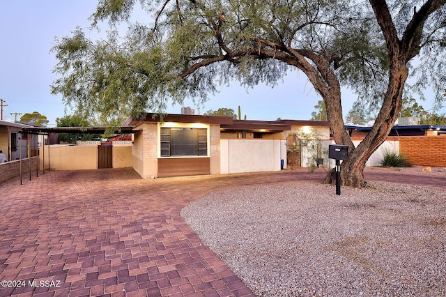 view of front of property featuring fence