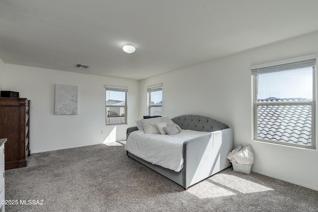 carpeted bedroom with visible vents