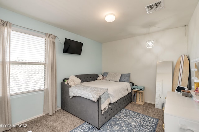 carpeted bedroom with baseboards and visible vents