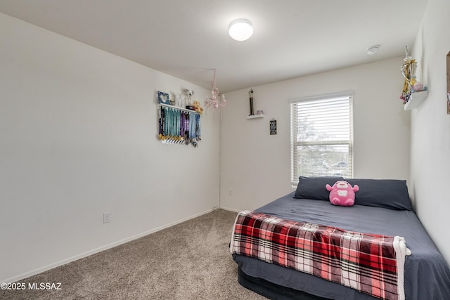 carpeted bedroom with baseboards