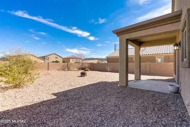 view of yard with a patio area and a fenced backyard