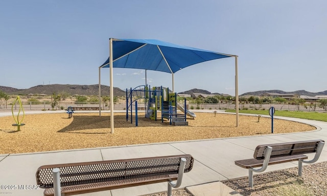 community jungle gym featuring a mountain view