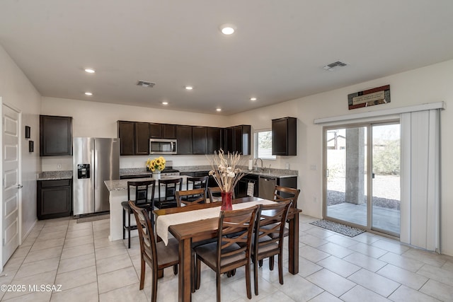 dining room featuring light tile patterned flooring, visible vents, and recessed lighting