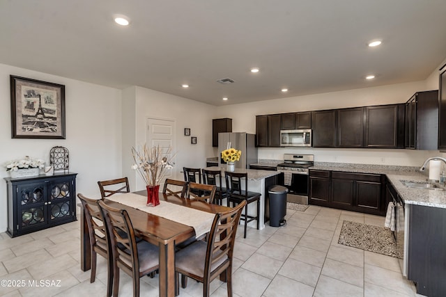 dining area with recessed lighting, visible vents, and light tile patterned floors