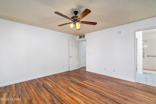9990 E Mary Dr, Tucson, AZ 85730 - interior space featuring a textured ceiling, visible vents, baseboards, a ceiling fan, and wood finished floors
