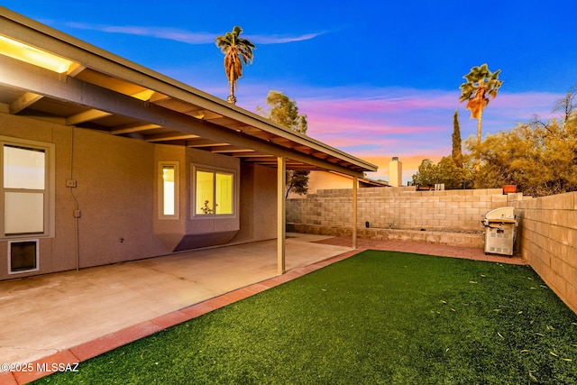 9990 E Mary Dr, Tucson, AZ 85730 - yard at dusk featuring fence and a patio area