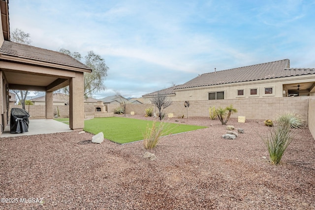 view of yard featuring a fenced backyard and a patio