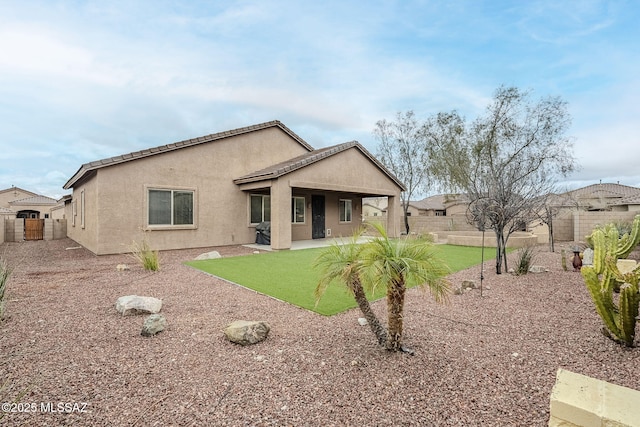 back of property featuring a patio area, a fenced backyard, and stucco siding