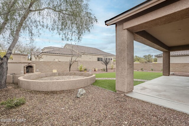 view of yard with a fenced backyard and a patio