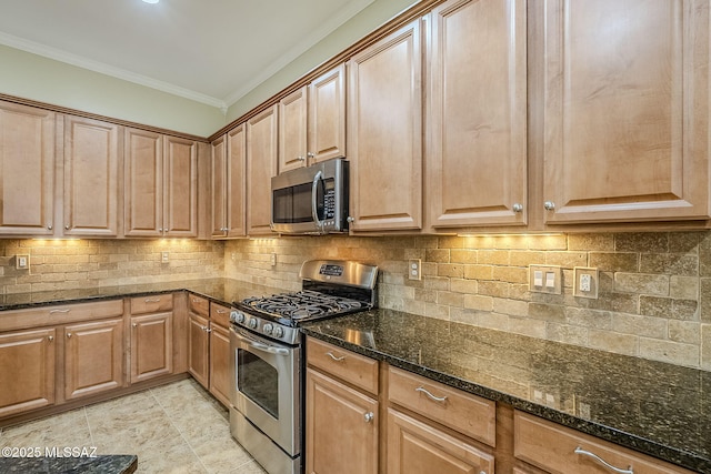 kitchen featuring light tile patterned floors, stainless steel appliances, tasteful backsplash, ornamental molding, and dark stone countertops