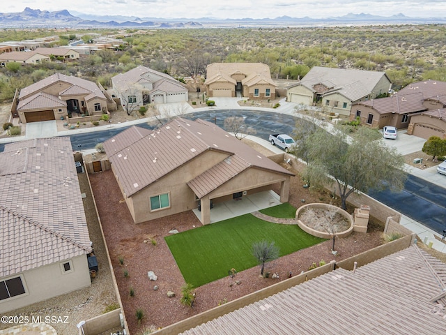 birds eye view of property featuring a mountain view and a residential view