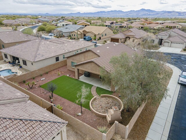 drone / aerial view with a residential view and a mountain view