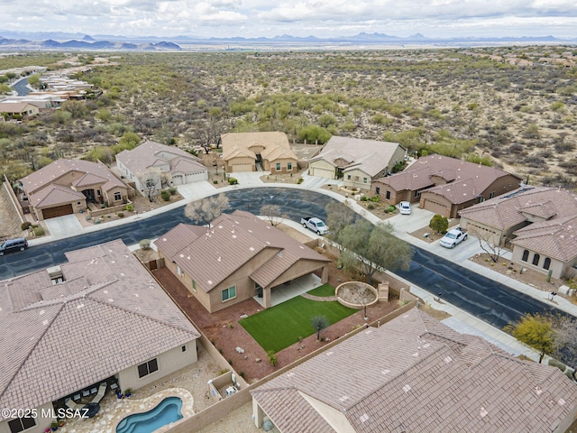 birds eye view of property with a residential view and a mountain view