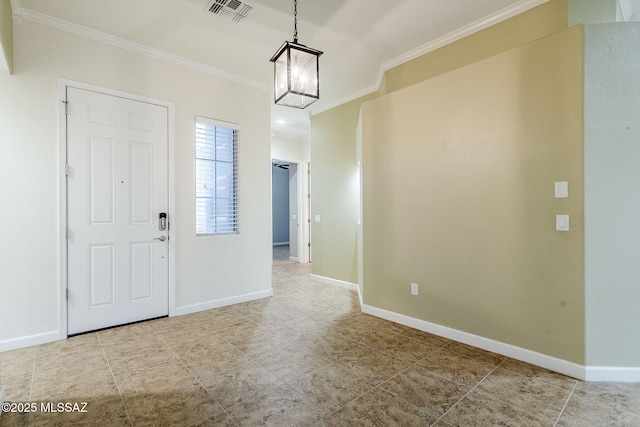 foyer with a chandelier, visible vents, crown molding, and baseboards