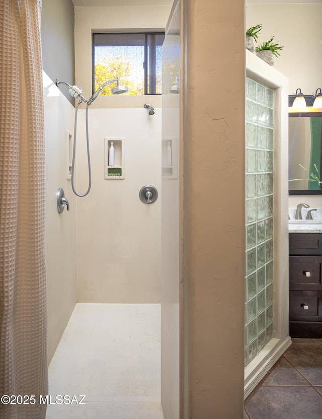 full bath with a shower with curtain and tile patterned flooring