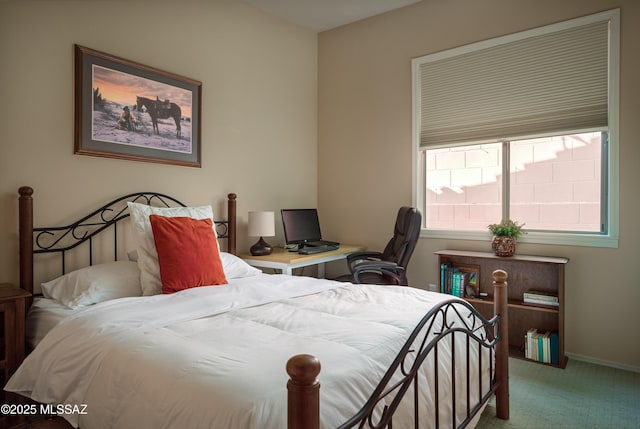 bedroom with carpet and baseboards