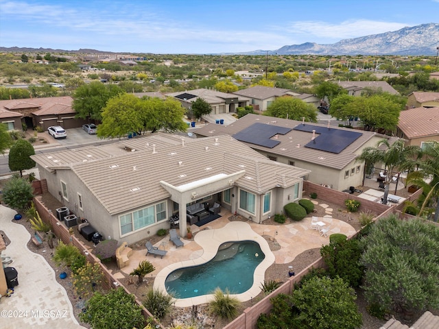 drone / aerial view featuring a residential view and a mountain view